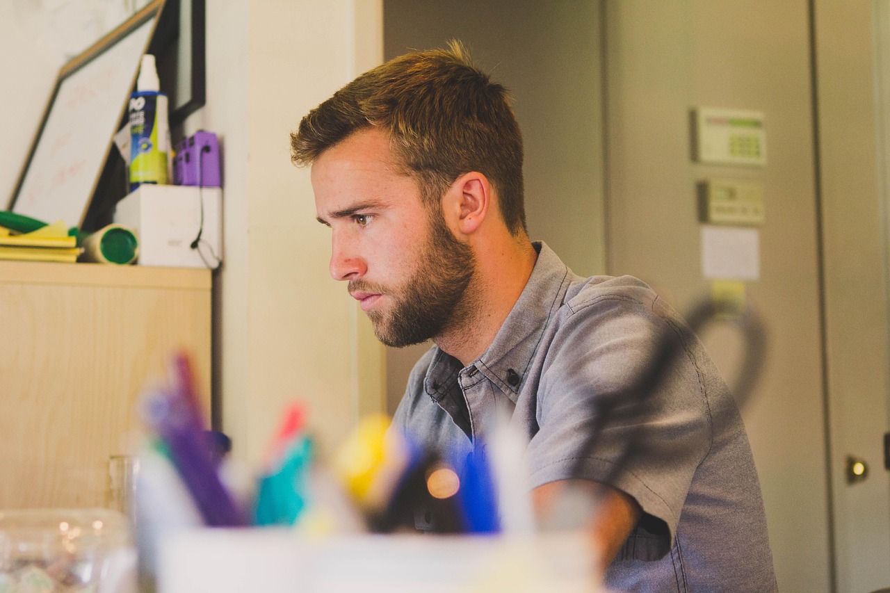 Man, work, desk — Affordable Private Investigator Melbourne for Fast Results