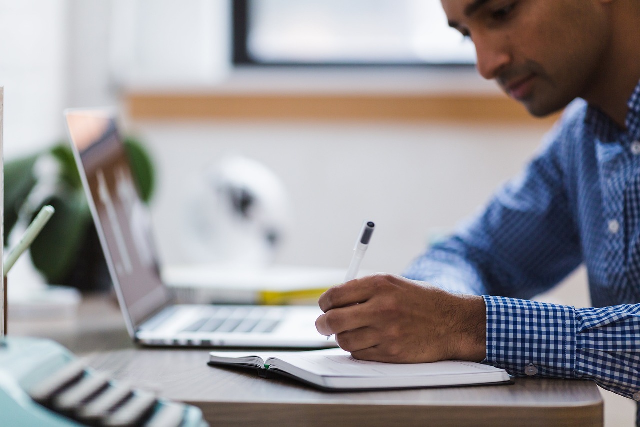Man, writing, laptop — Practices That Can Make Your Computer 'Healthier'