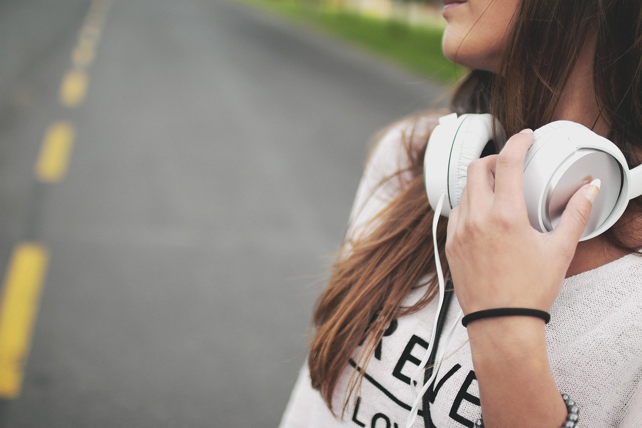 Girl, music, headphones — Reasons to Use the Postal Validation Services