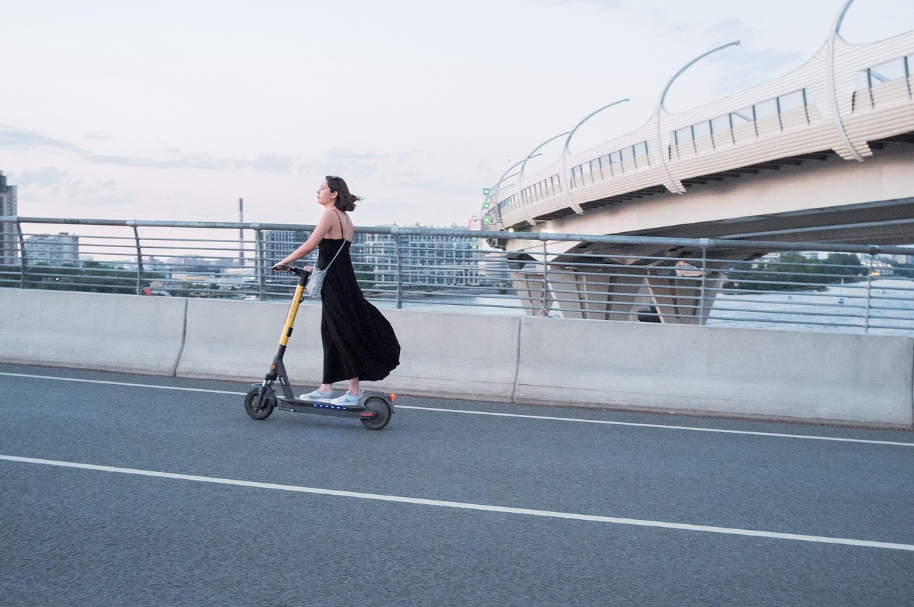 Woman, electric scooter, street — "Top Identity Verification Services to Safeguard Your Business"